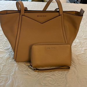 Michael Kors tan purse and matching wallet.